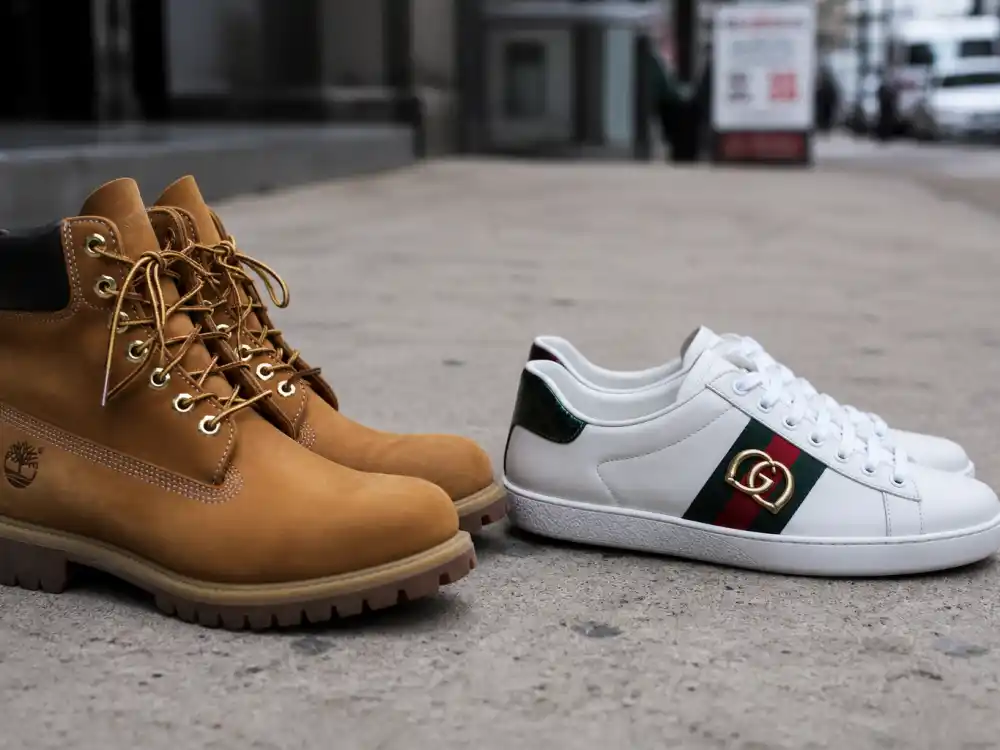 Wheat Timberland boots and designer sneakers finishing how to dress like A$AP Rocky streetwear style footwear layer