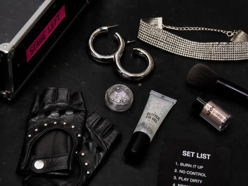 Rhinestone choker and hoop earrings defining how to dress like Dua Lipa stage style accessory finish