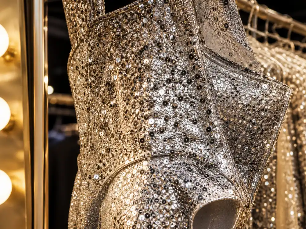 Sequin fabric texture on stage costume defining how to dress like Dua Lipa stage style sparkle discipline