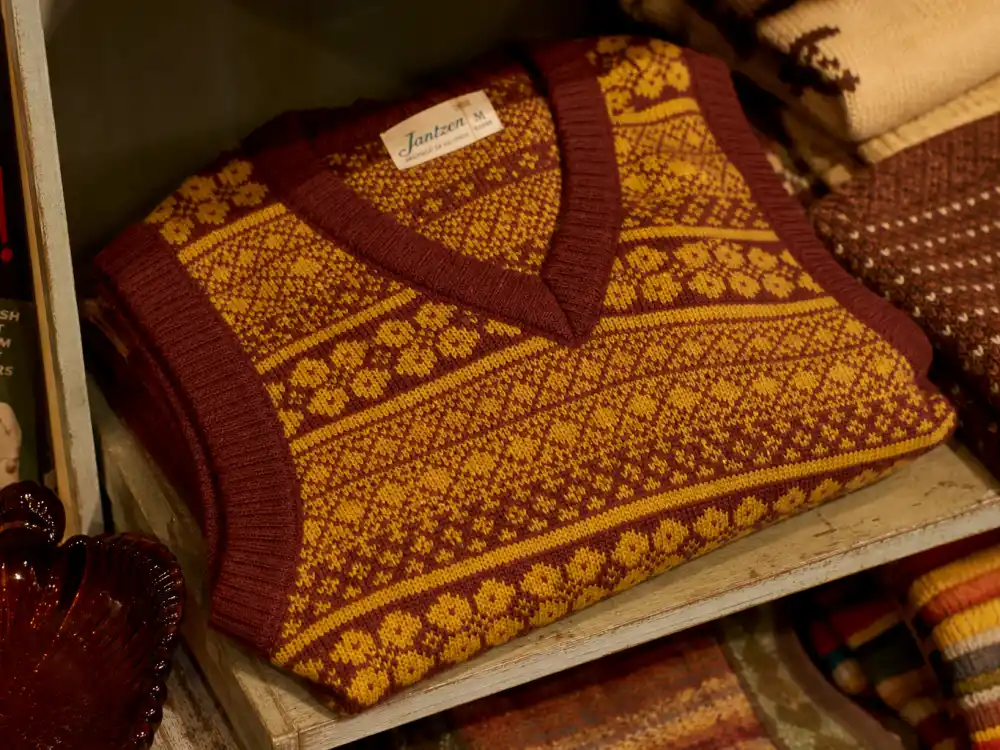Mustard cable-knit sweater vest defining how to dress like Harry Styles vintage fashion layering rotation