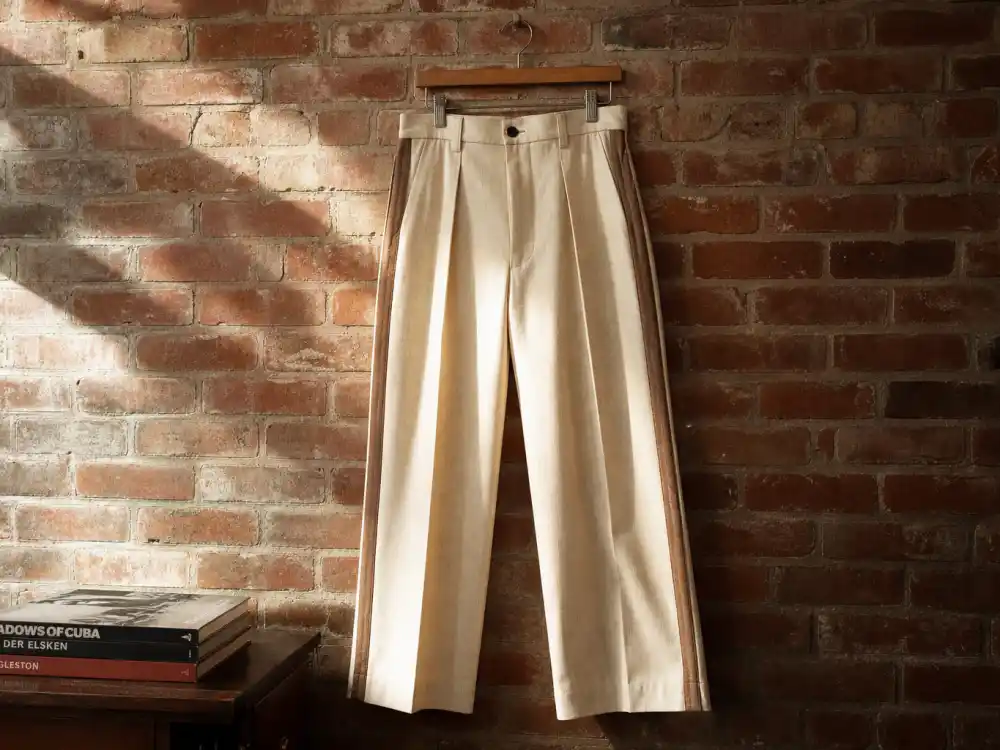 Wide-leg pleated vintage trousers central to how to dress like Harry Styles vintage fashion silhouette codes