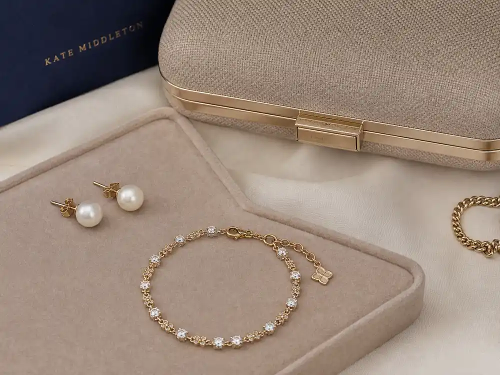 Pearl earrings and structured clutch finishing how to dress like Kate Middleton classic fashion accessory layer