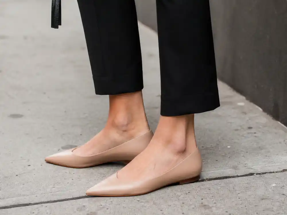 Pointed toe nude flats with cropped trousers illustrating how to dress like Olivia Palermo street style footwear discipline