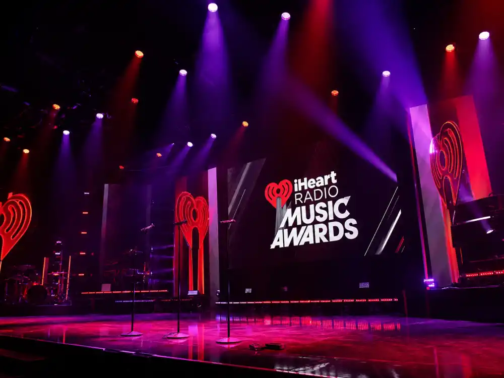 Concert performance stage with spotlights during iHeartRadio Music Awards 2026 winners ceremony live sets at Dolby Theatre