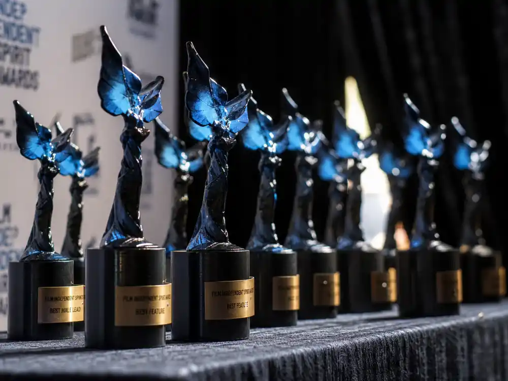 Blue bird Spirit Award statuettes lineup for Independent Spirit Awards explained — Best Feature, Best First Feature, and performance categories on display