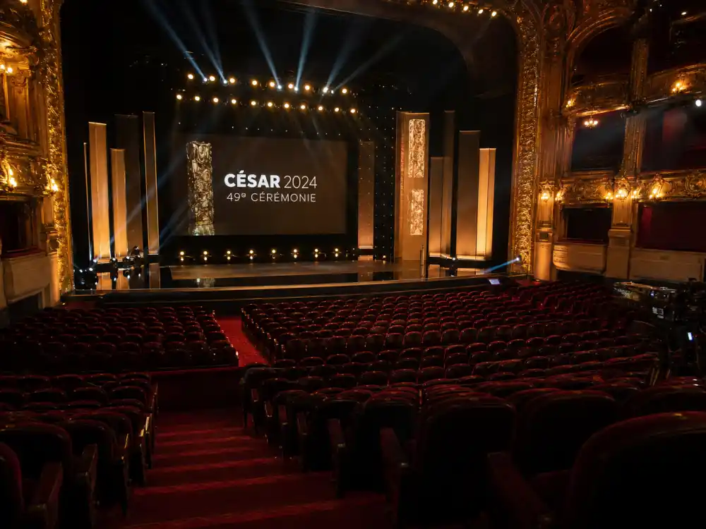 César Awards France ceremony theater for international award shows Americans should know — Paris auditorium stage with French cinema trophy silhouette