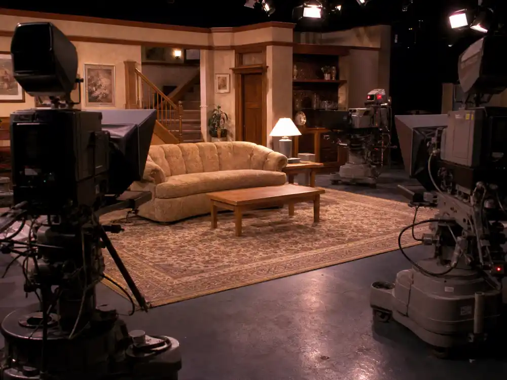 A vintage 1990s TV sitcom soundstage evoking Jaleel White as Steve Urkel on Family Matters