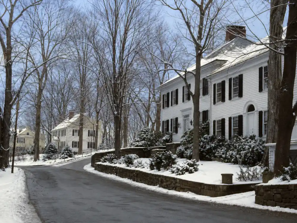 Snowy Connecticut suburban street for what happened to James Van Der Beek before Dawson's Creek fame