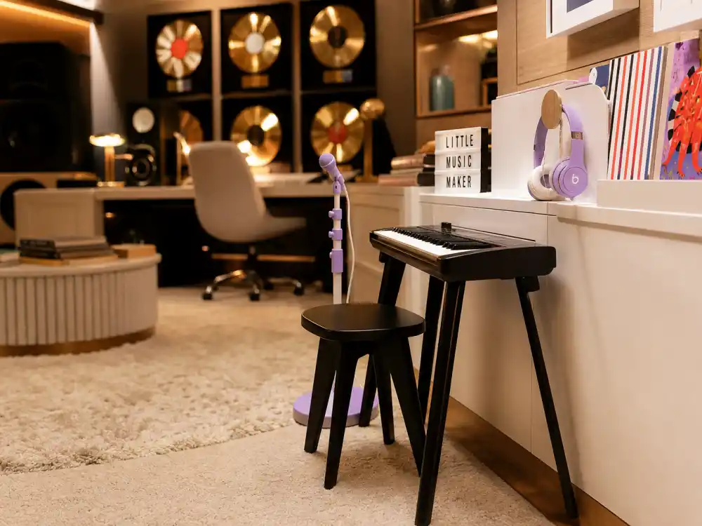 Home music studio kid corner in Jay Z Beyonce kids Rumi Sir Blue Ivy guide — child headphones and keyboard in Carter family creative space