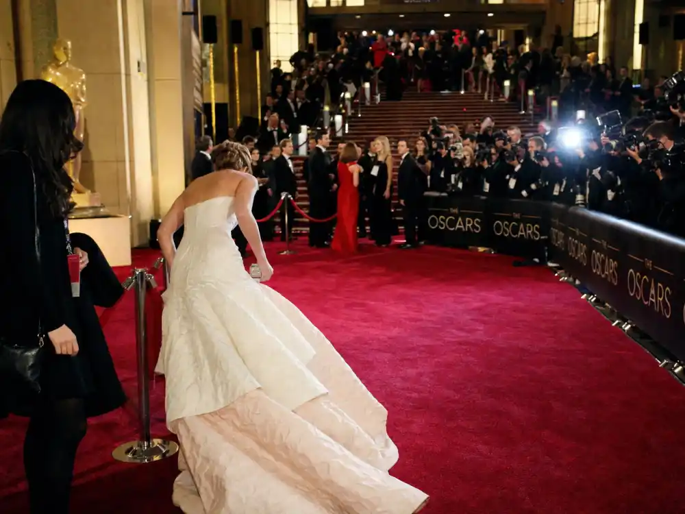 Oscars red carpet arrivals atmosphere surrounding Jennifer Lawrence tripping Oscars dress legacy at the 85th Academy Awards fashion moment