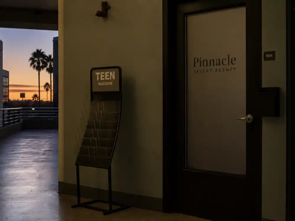 An empty talent agency corridor at dusk symbolizing Jonathan Lipnicki post-child-star career slowdown