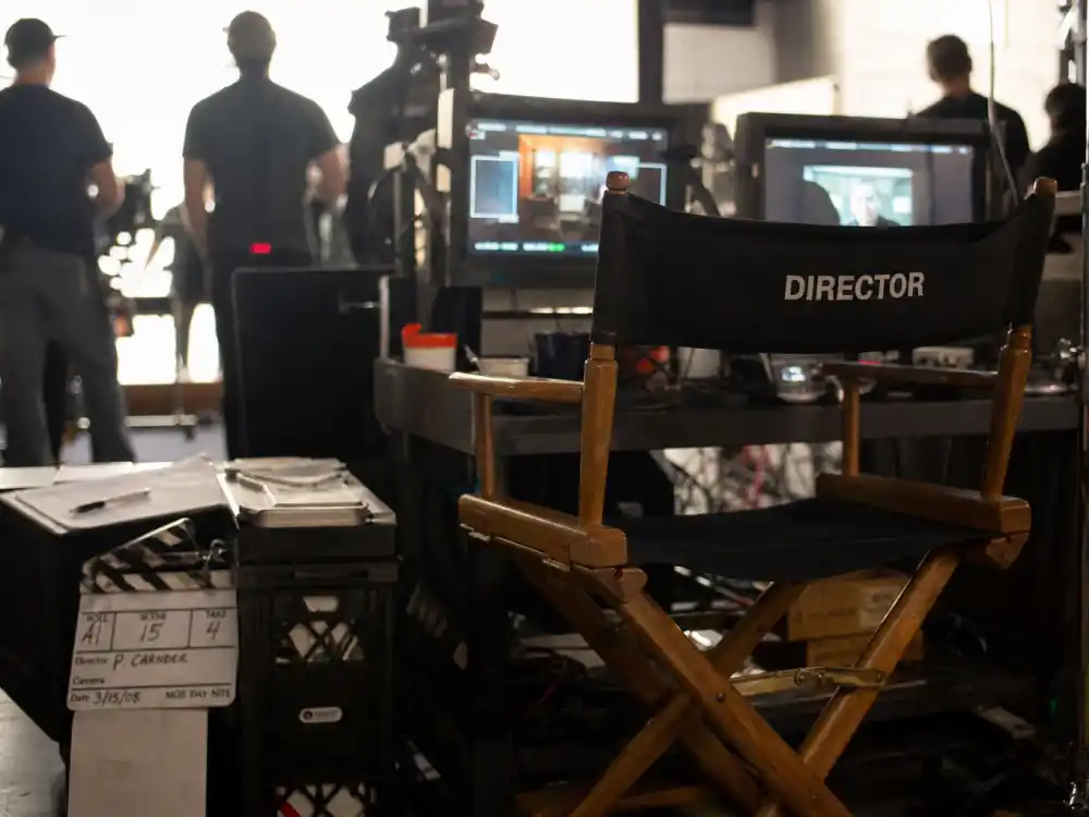 A director's chair and monitors on a film set representing Jonathan Taylor Thomas behind-the-camera directing work