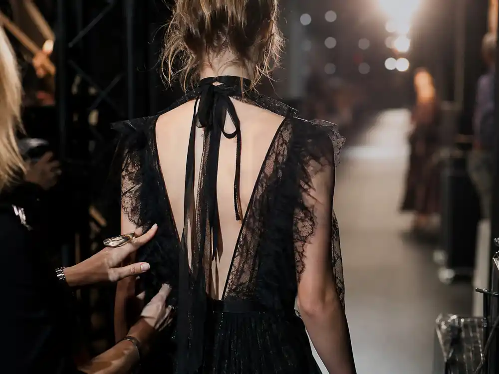 Paris fashion week runway backstage from behind for Kaia Gerber nepo baby modeling career Chanel Miu Miu catwalk lane editorial without identifiable faces