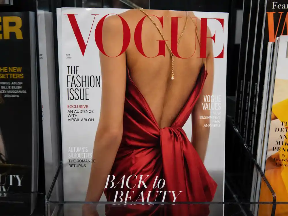 Vogue cover mockup on newsstand for Kaia Gerber nepo baby modeling career editorial portfolio spread without identifiable faces