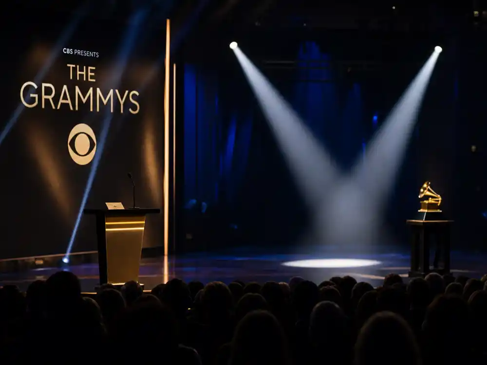 Tense awards podium envelope reveal captures stage incidents central to Kanye West Grammy moments controversies including the 2015 Beck Album of the Year speech