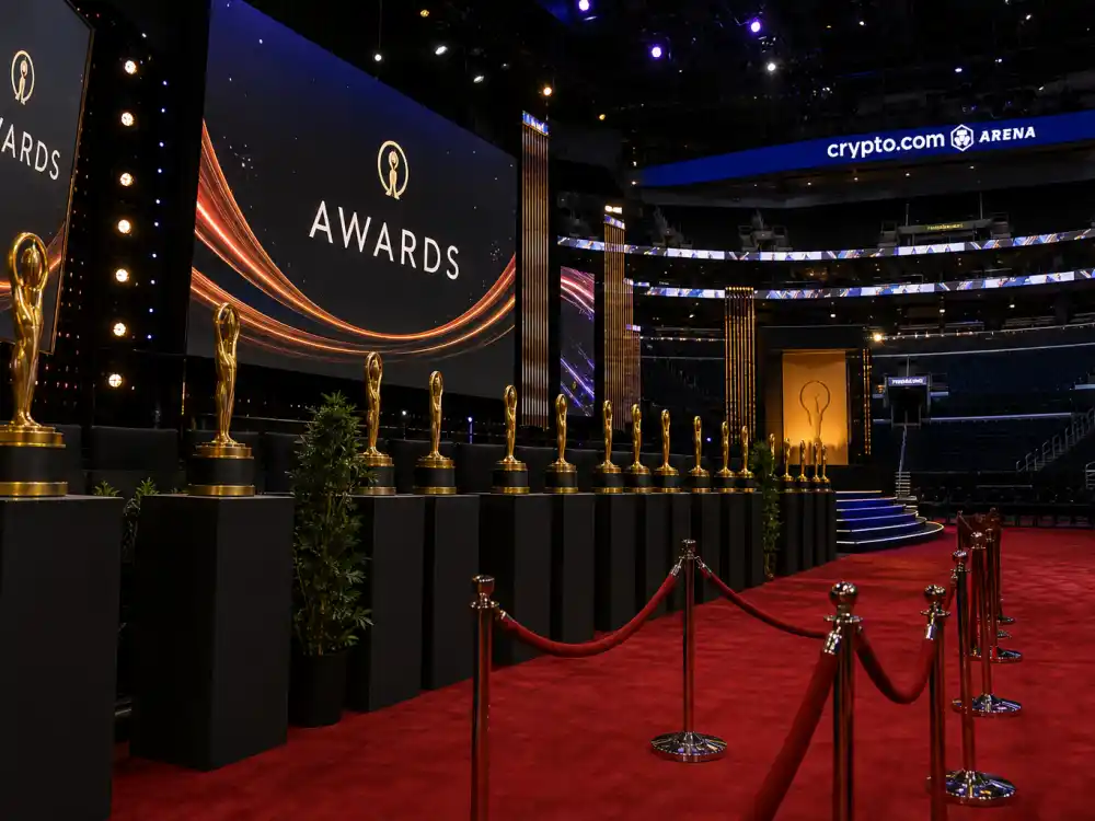 Modern awards arena with LED screens shows how Kanye West Grammy moments controversies still dominate social media after every February Grammy telecast