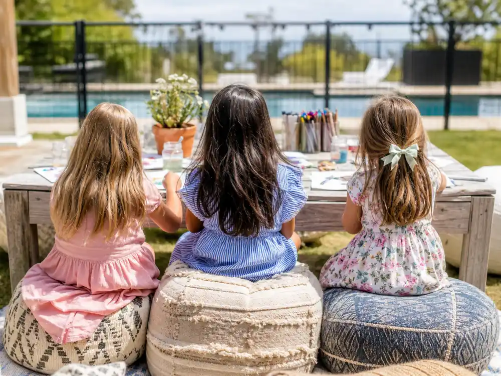 Kids playdate craft table from behind for Kardashian Jenner kids godparents and friends — Stormi True Chicago cousin cluster People verified without faces