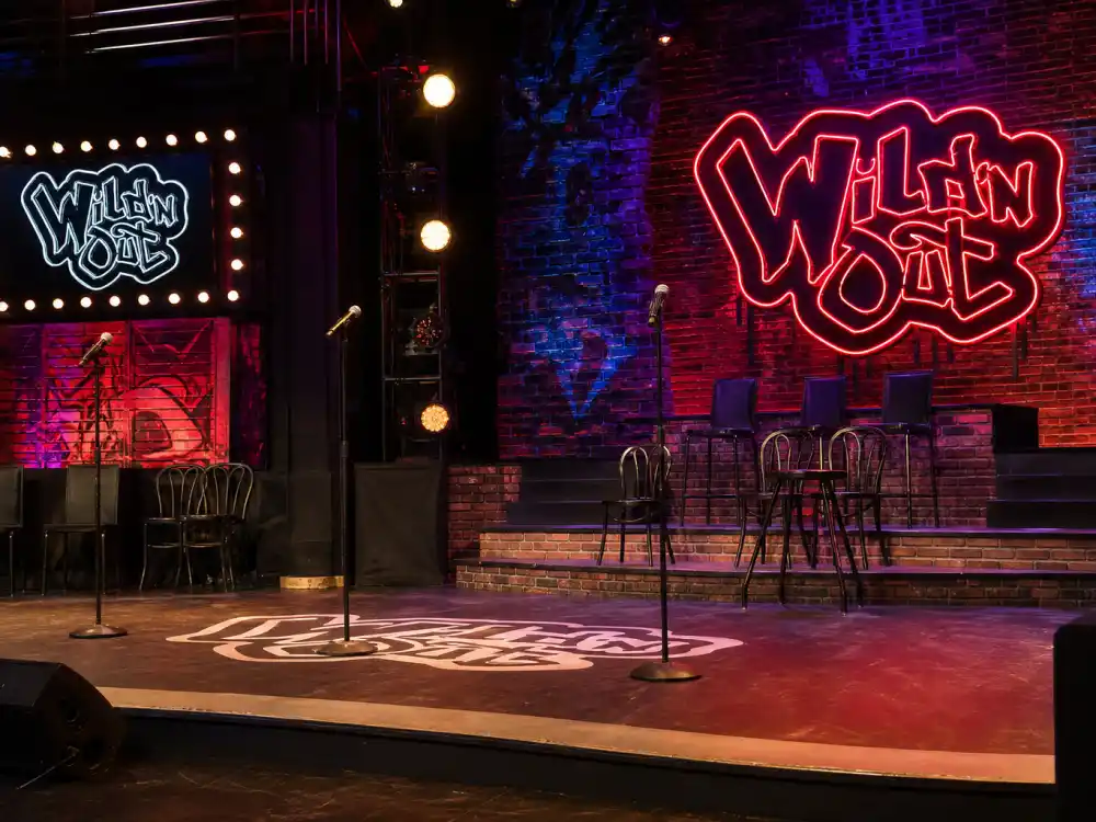 Comedy improv stage with neon backdrop for Kel Mitchell Wild N Out MTV comeback years