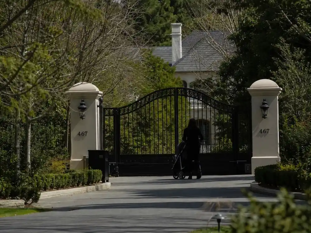Gated home stroller silhouette for Khloe Kardashian kids True and Tatum guide privacy era — limited face-forward paparazzi shots