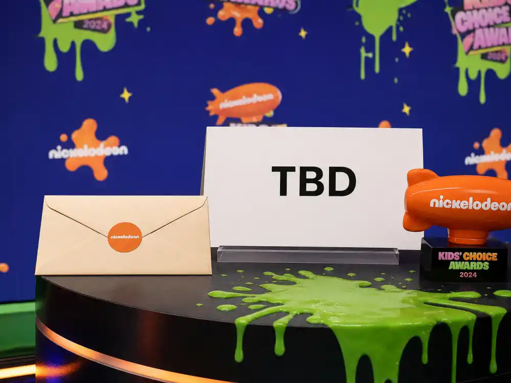 Sealed envelope on podium beside blank winner placard before November 14 when the Kids Choice Awards 2026 winners list goes live