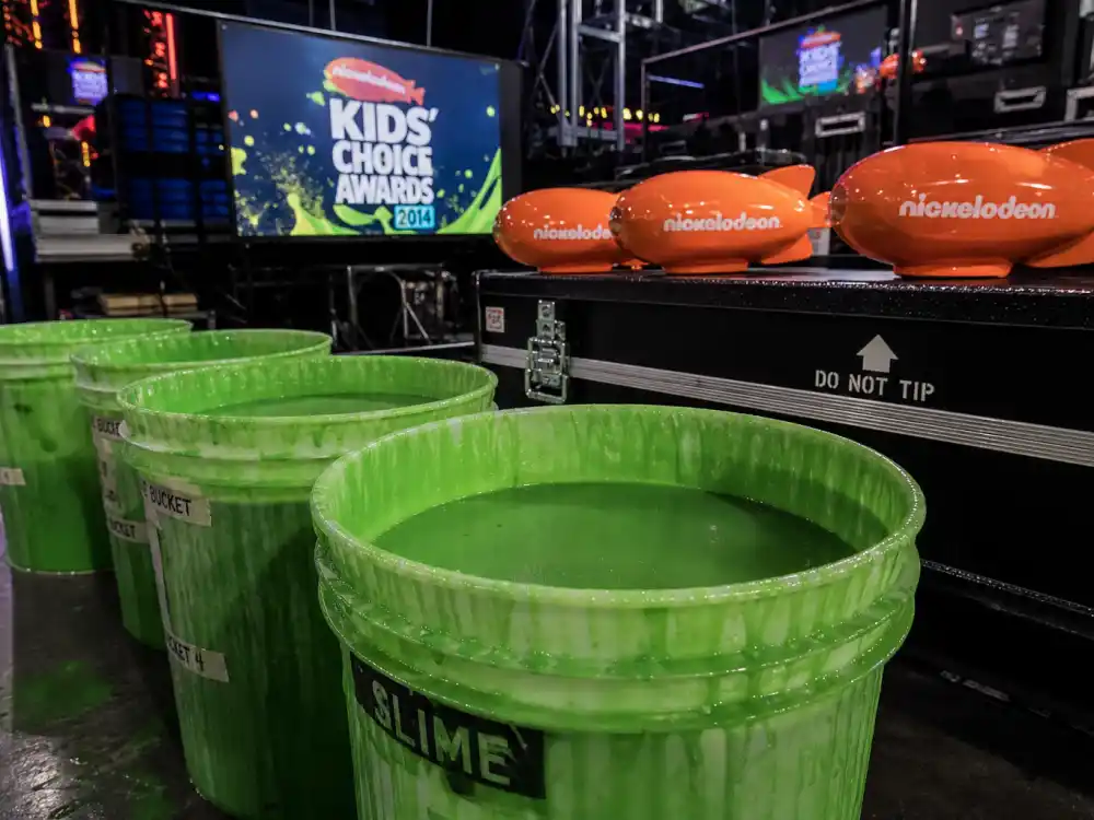 Green slime buckets backstage at Kids Choice Awards slime history famous slimings and surprise dunks section