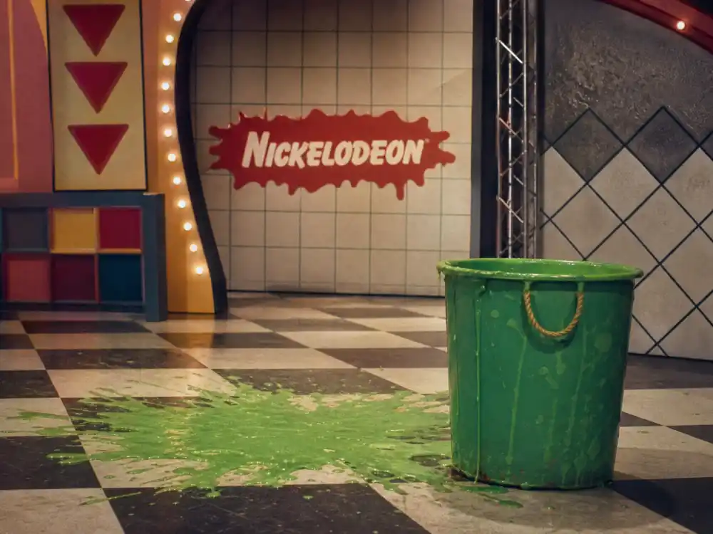 Vintage 1980s Nickelodeon studio set with green slime bucket for Kids Choice Awards slime history origins on You Cant Do That on Television