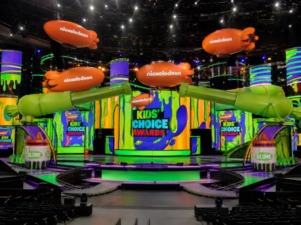 Nickelodeon Kids Choice Awards stage with green slime cannons for Kids Choice Awards slime history modern ceremony setup