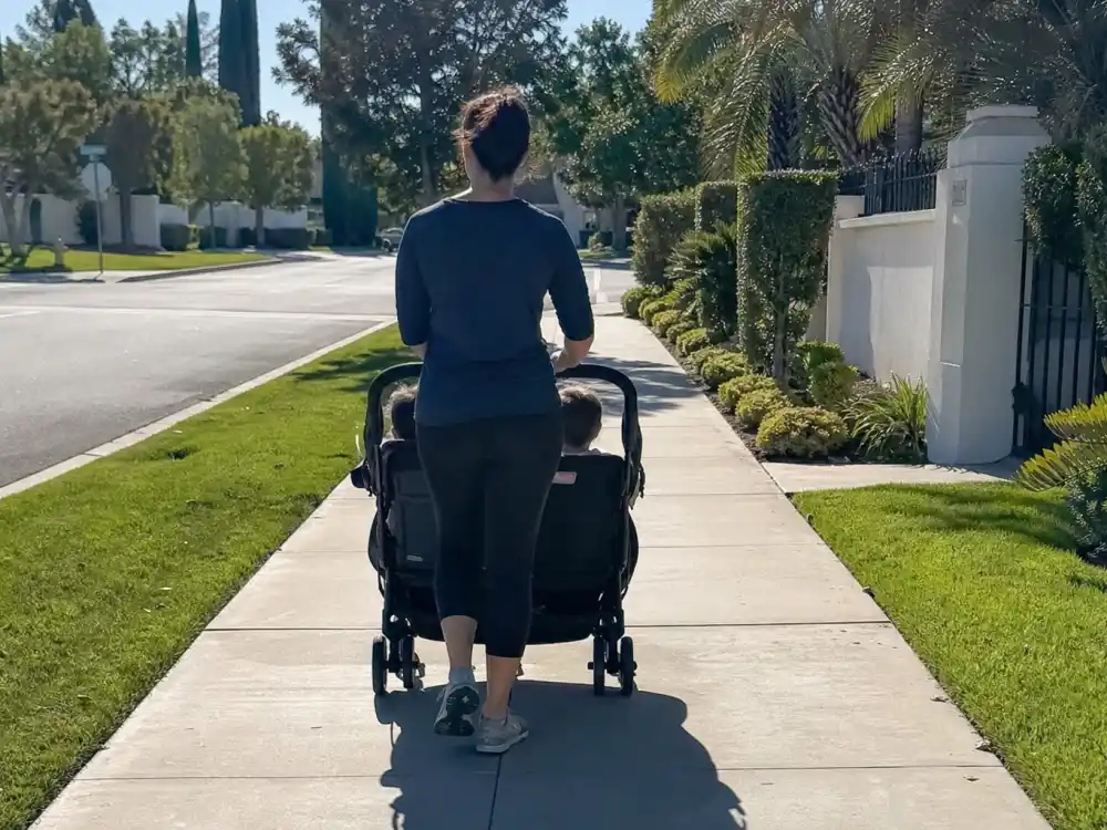 Anonymous parent pushing double stroller for Kourtney Kardashian kids Mason Penelope Reign — Scott Disick co-parenting context