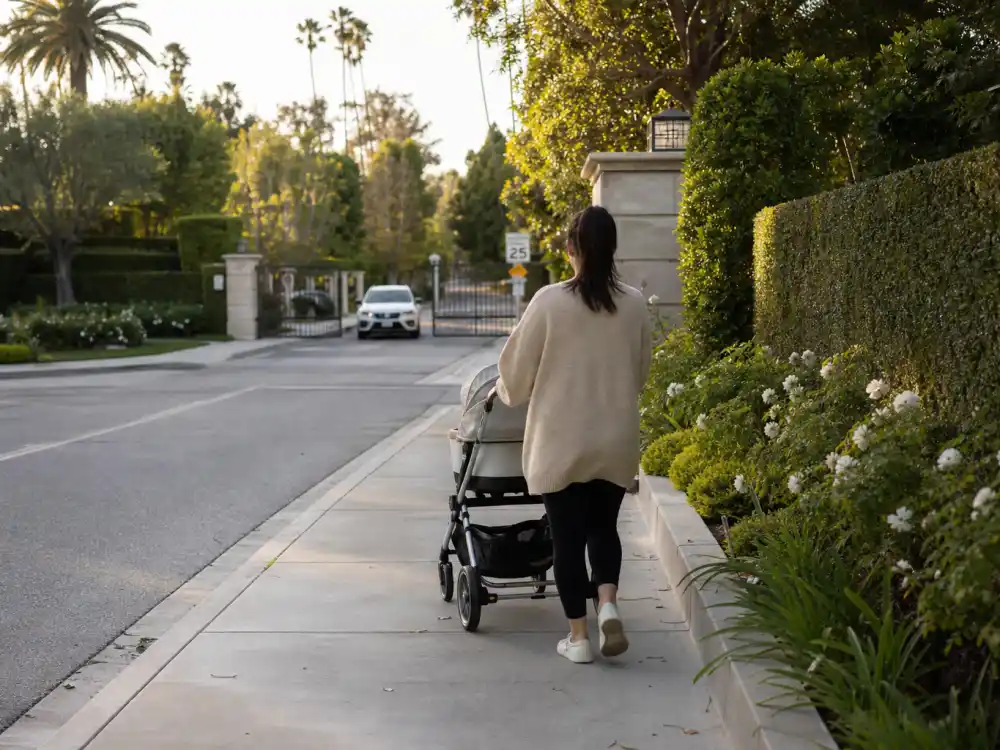 Anonymous parent pushing stroller for Kylie Jenner kids names and ages — Travis Scott co-parenting context with Stormi and Aire Webster
