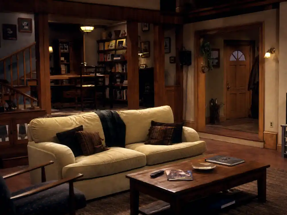 A 1990s family drama TV set living room evoking Lacey Chabert Party of Five fame as Claudia Salinger