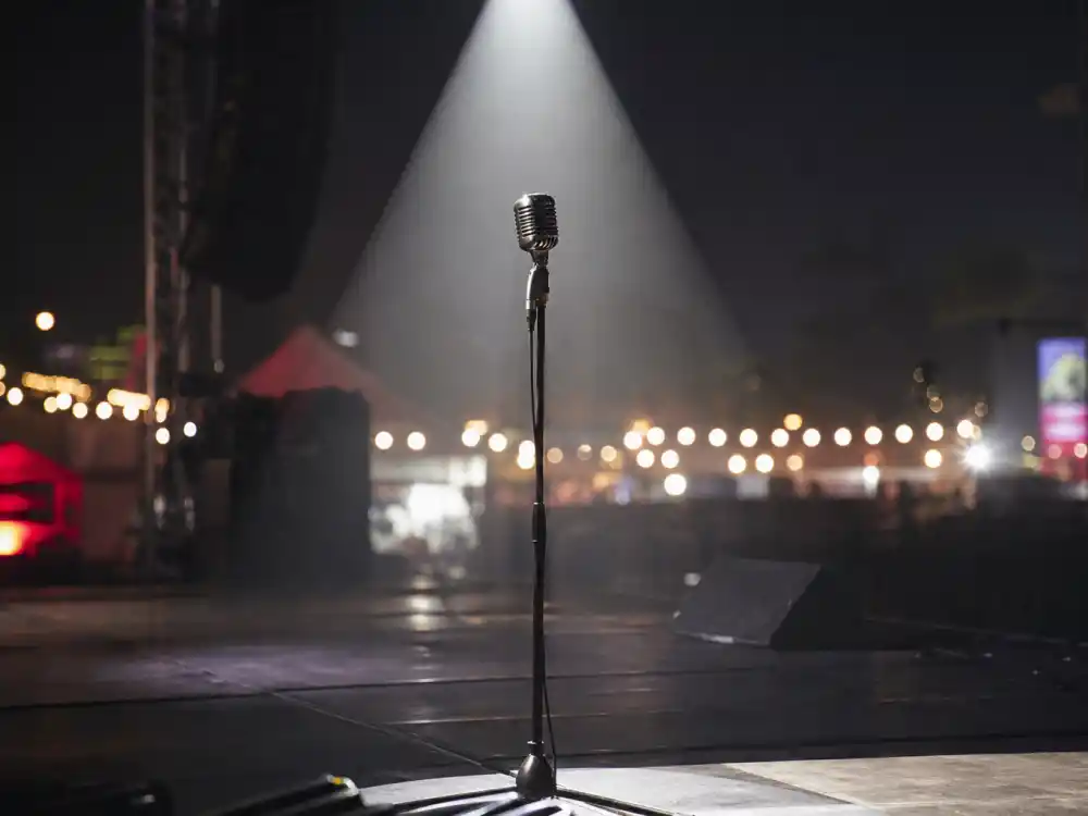 Empty festival stage microphone for what happened to Lauryn Hill now as Ms Lauryn Hill in 2026