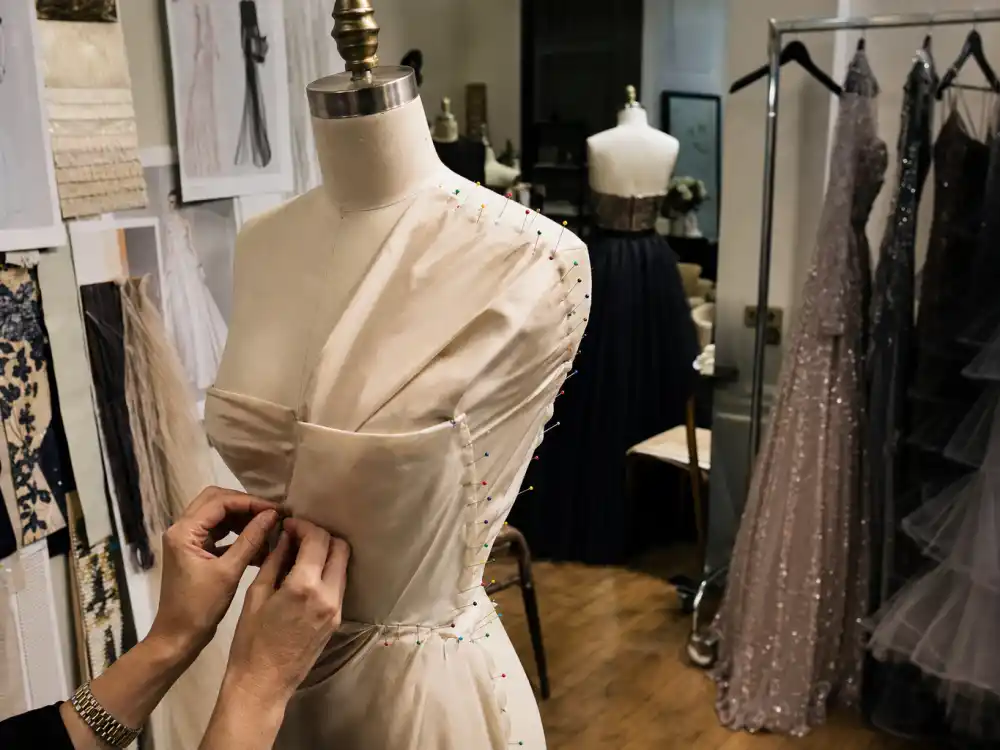Celebrity stylist atelier with couture gown racks and mood boards illustrating Law Roach styling Zendaya fitting-room preparation and red carpet planning workflow