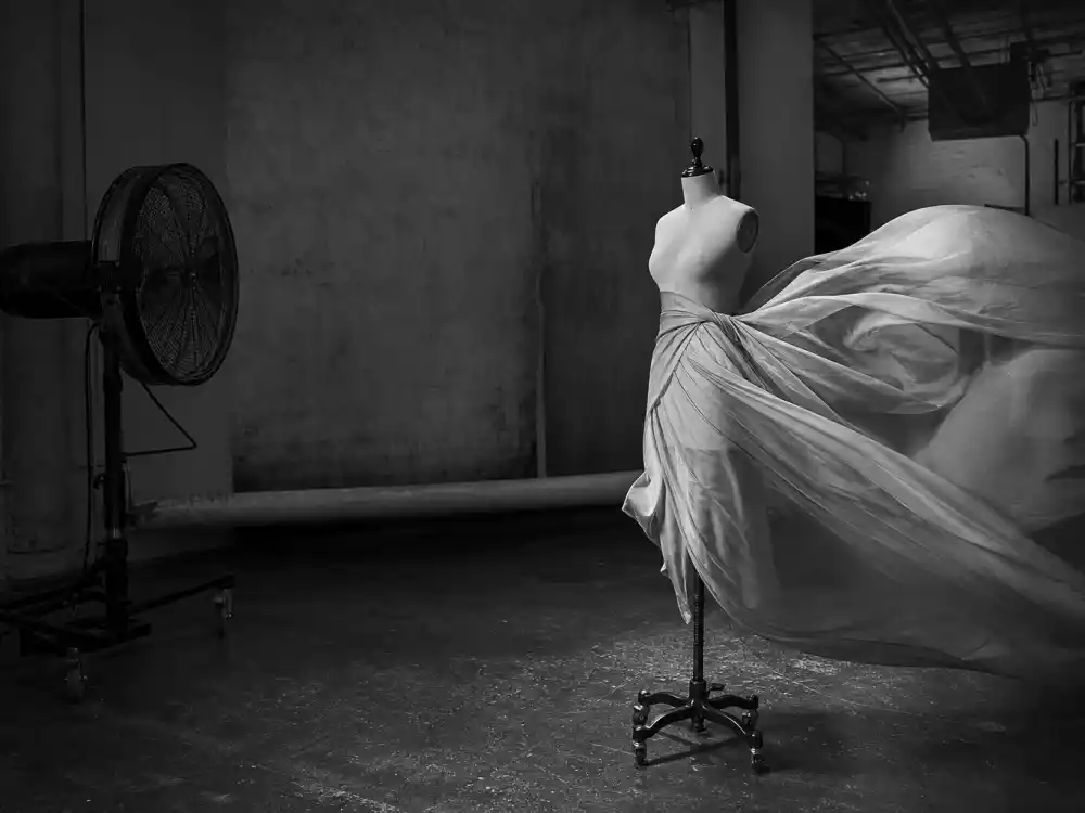Wind-machine fashion studio scene evoking Linda Evangelista George Michael Freedom 90 video icon status