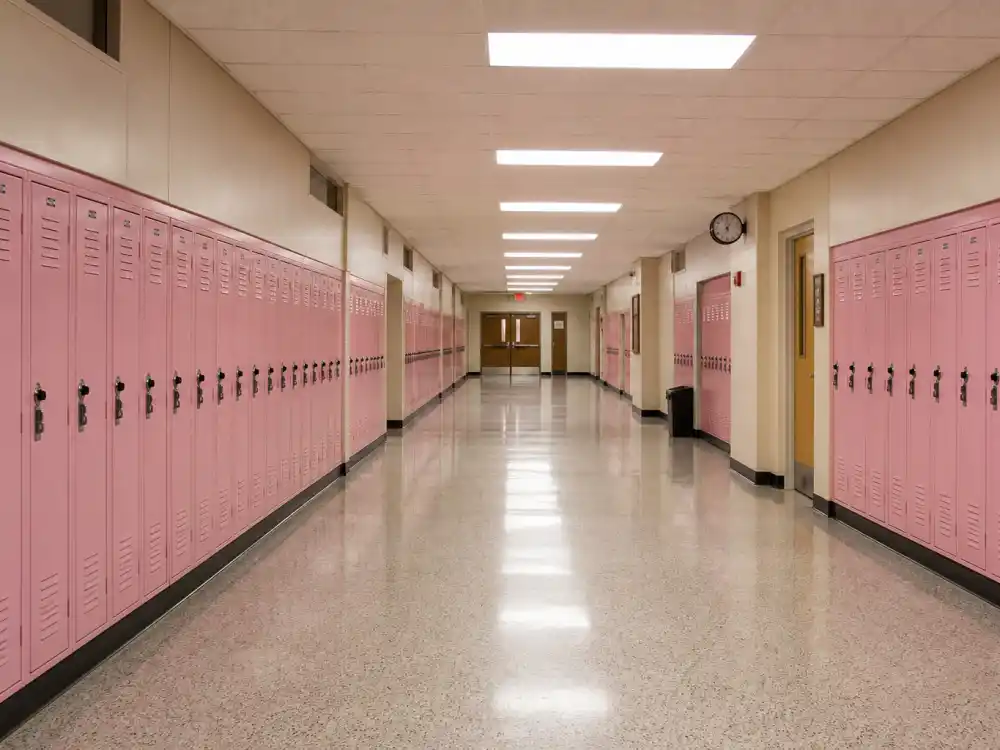 A high school hallway with pink lockers evoking Lindsay Lohan Mean Girls fame as Cady Heron