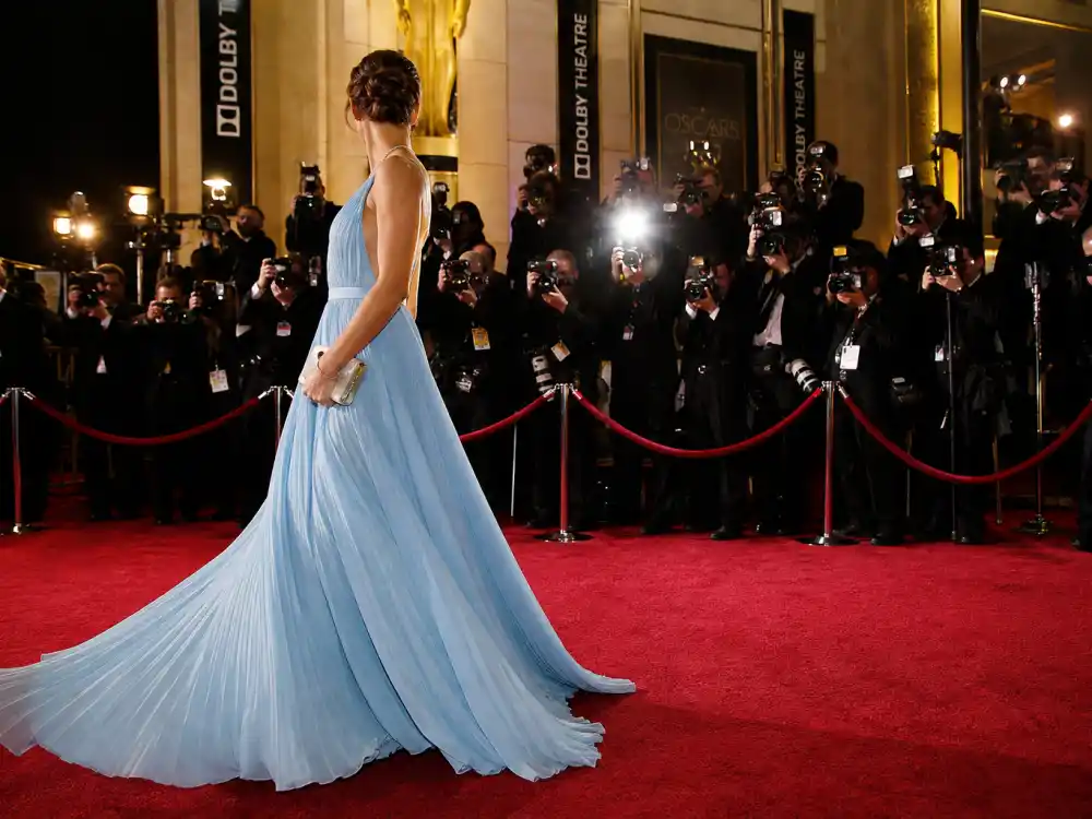 Dolby Theatre Oscars red carpet rope line where the Lupita Nyongo blue Oscars gown debuted under photographer flash bulbs in March 2014