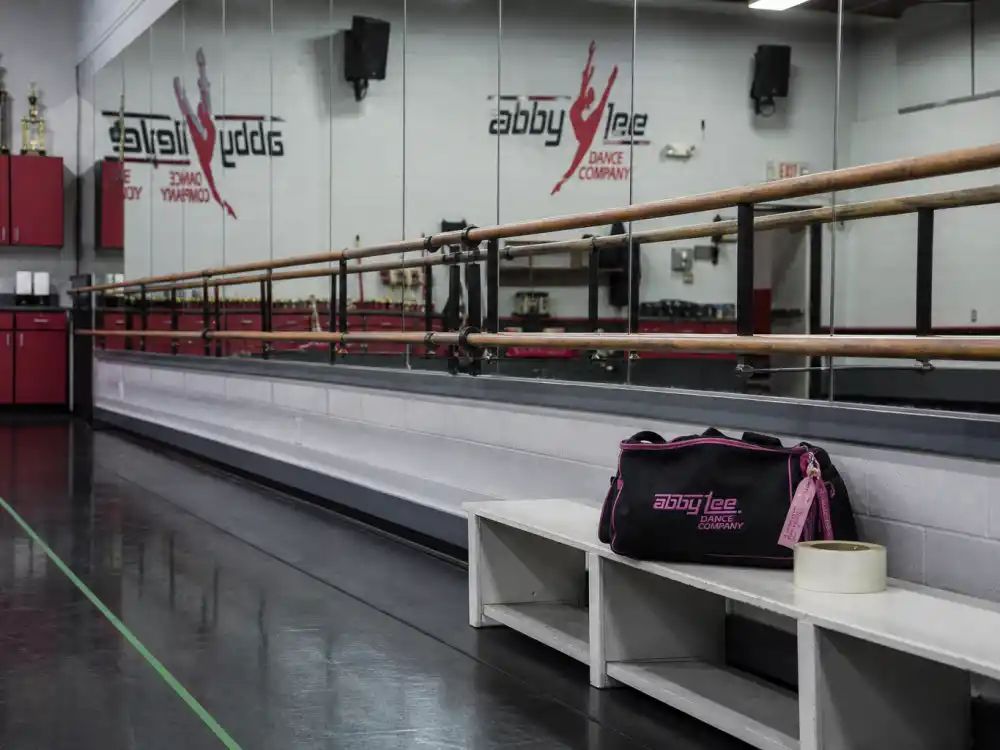 Empty Dance Moms-style studio with ballet barre for Mackenzie Ziegler baby announcement 2025 — former ALDC star now singer and TikTok creator at age 21
