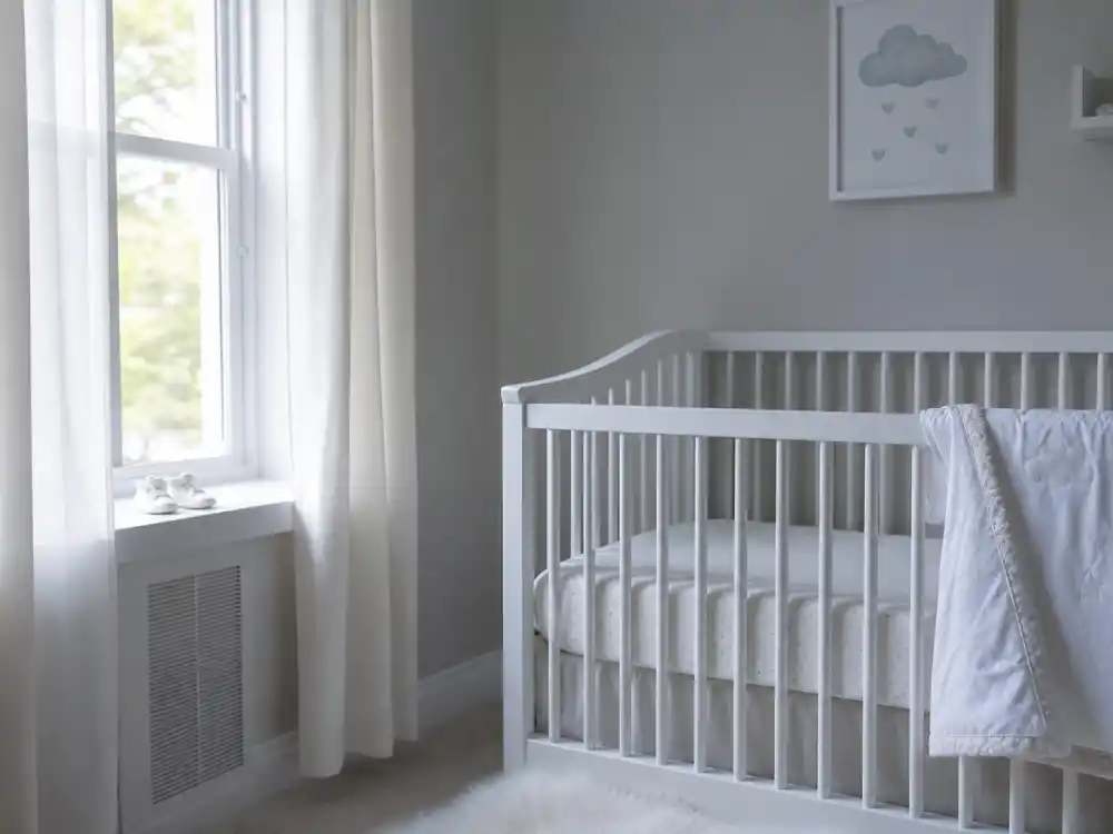 Empty aspirational nursery with tiny booties for Mackenzie Ziegler baby announcement 2025 search intent — no verified human pregnancy through mid-2026