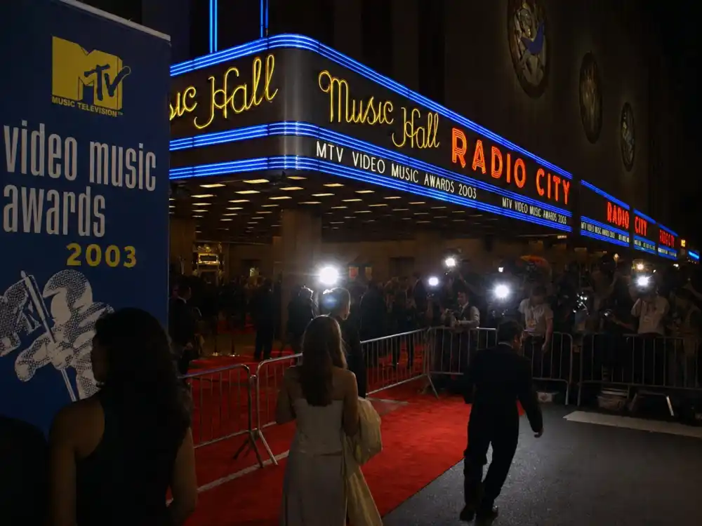 Radio City Music Hall exterior on 2003 MTV VMA night anchors the Madonna Britney Christina VMA kiss story in the late-summer awards season New York telecast