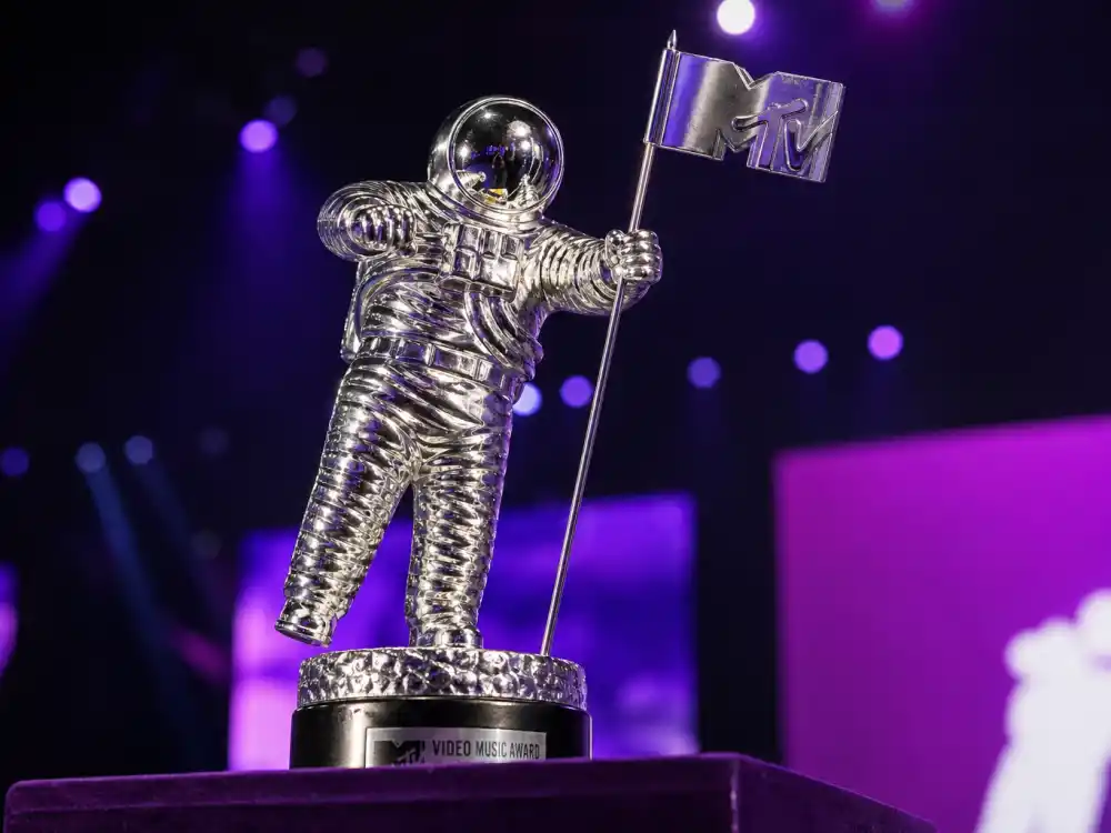 Silver Moon Person trophy close-up for Madonna Britney Christina VMA kiss story — the statuette MTV presented throughout the 2003 Video Music Awards ceremony