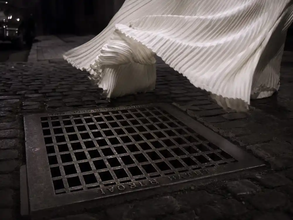 Manhattan subway ventilation grate and billowing white pleated fabric defining the Marilyn Monroe white dress history subway scene moment