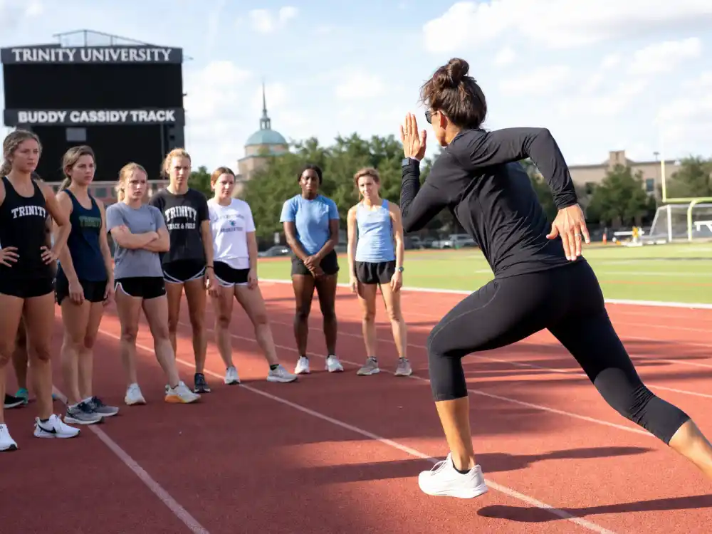Track coach mentoring young sprinters for where is Marion Jones now in 2026 coaching life