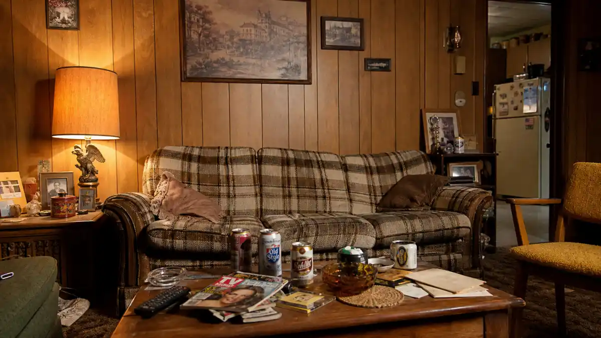 Married with Children cast where are they now — worn 1980s suburban Chicago living room with iconic Bundy couch