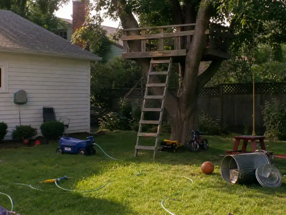 Suburban lawn props evoking Mason Gamble Dennis the Menace fame in 1993