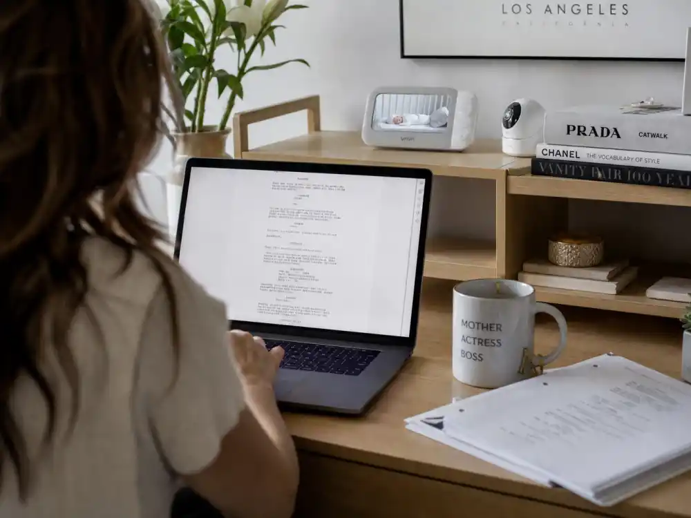 Calm home office with scripts and baby monitor reflecting the selective Megan Fox career choices in 2026