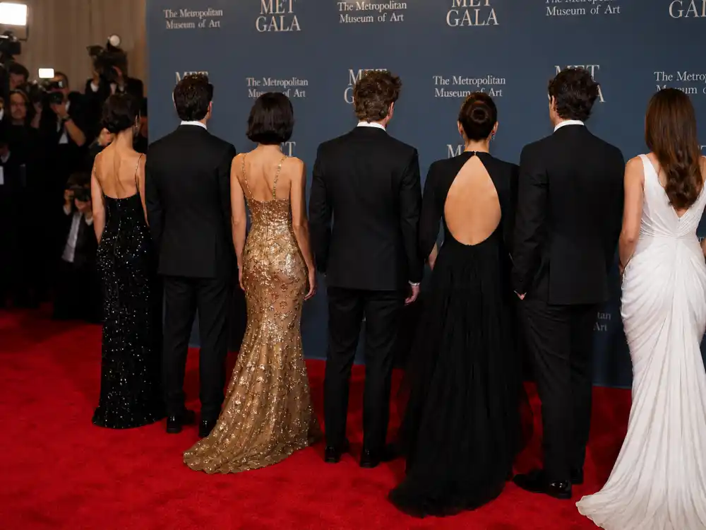 Met Gala 2026 guest list press wall and camera flashes as A-list arrivals walk the Metropolitan Museum red carpet