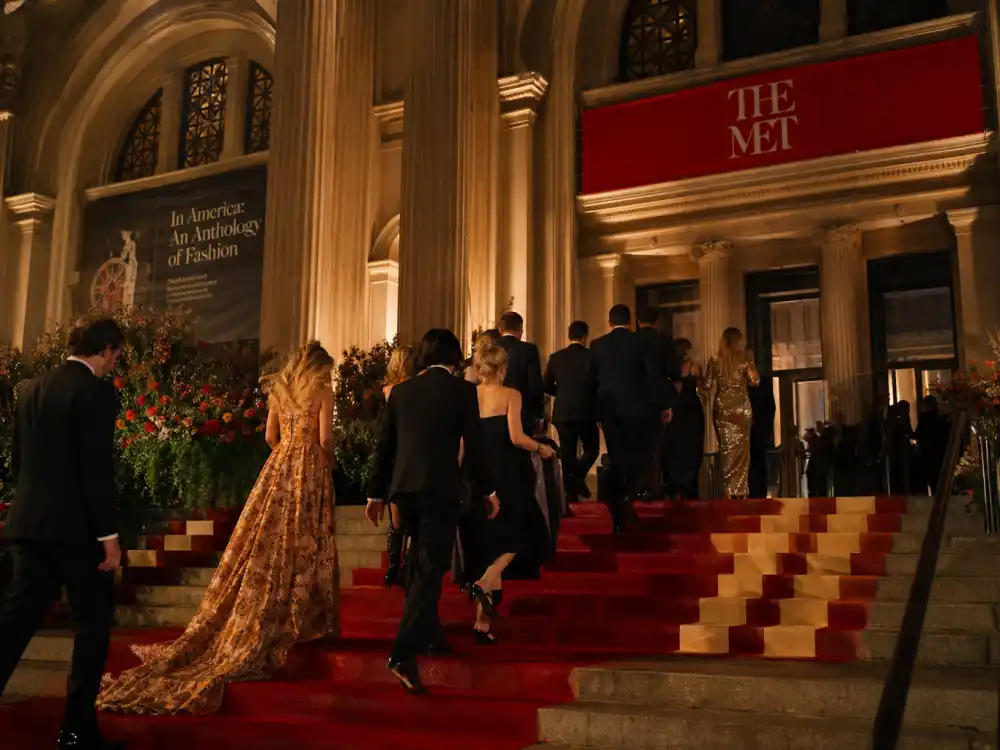 Metropolitan Museum steps where Met Gala themes by year complete list dress codes come alive each May