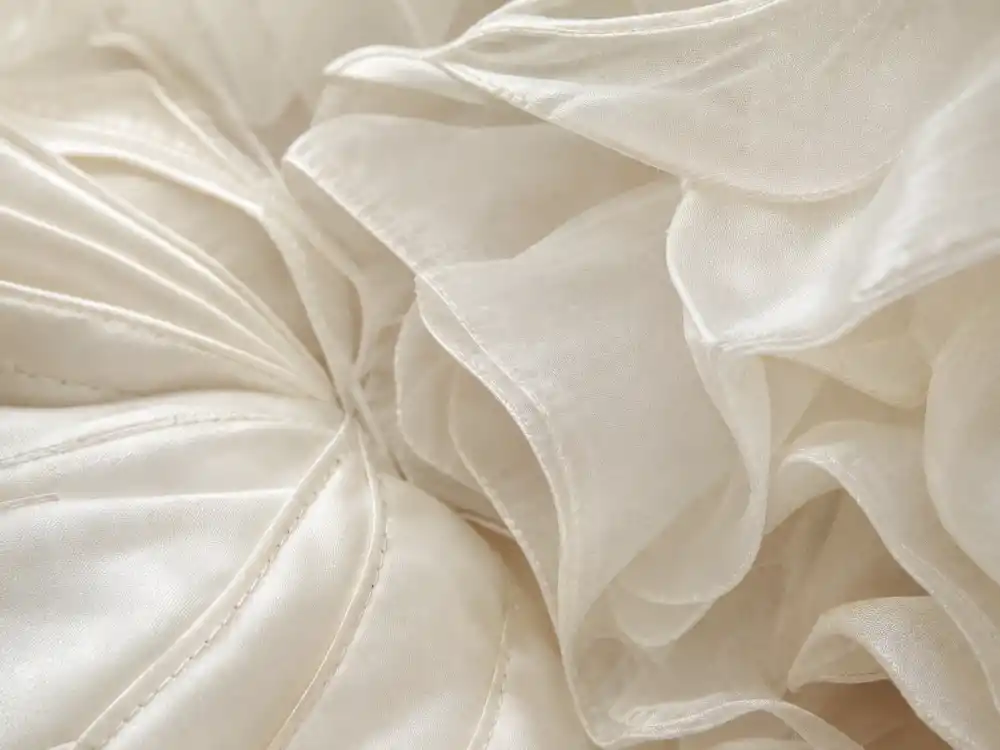 Layered white chiffon and silk organza textile detail defining the Michelle Obama Jason Wu inaugural gown hand-finished construction