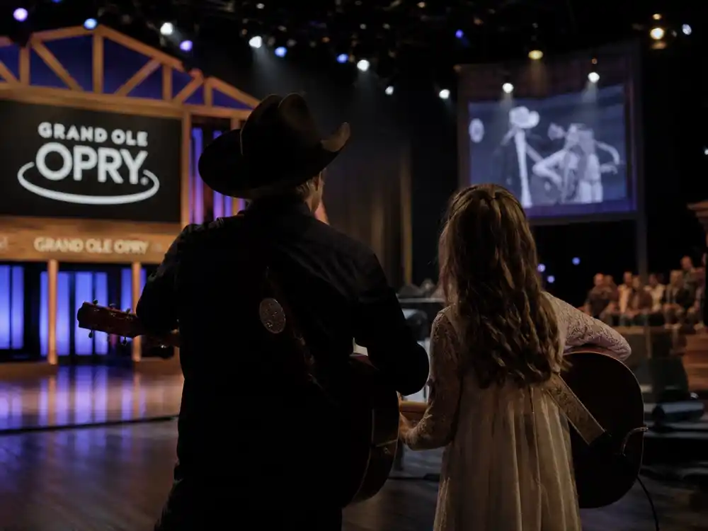 Father daughter country TV studio from behind for Miley Cyrus Billy Ray Cyrus fame story family dynasty editorial without identifiable faces