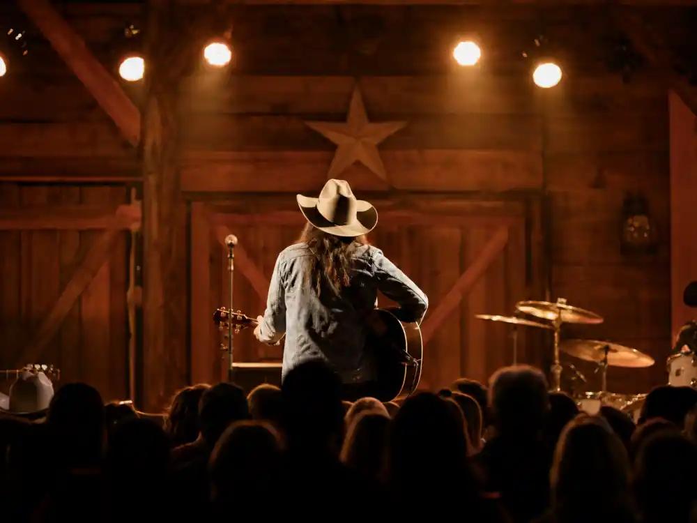 Country music stage from behind for Miley Cyrus Billy Ray Cyrus fame story Billy Ray Achy Breaky Heart roots editorial without identifiable faces