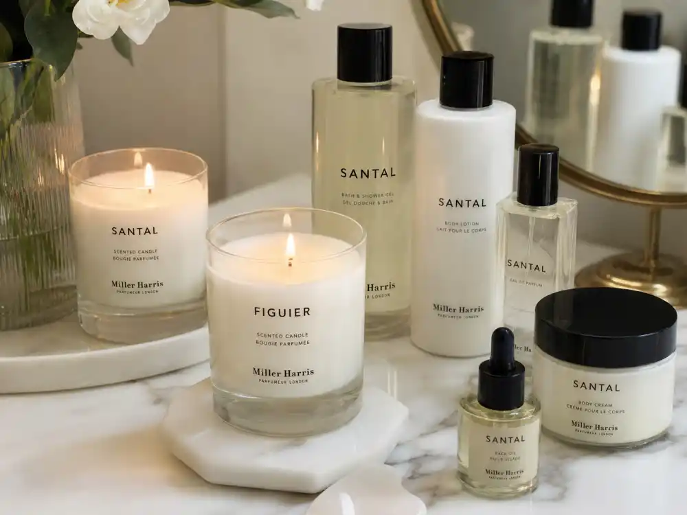 Luxury candles and skincare on a vanity, reflecting Mischa Barton beauty brand and entrepreneur work